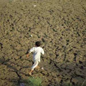 A young flood victim runs as he plays at a relief camp in Mohib Banda near Charsadda A young flood victim runs as he plays at a relief camp in Mohib Banda near Charsadda