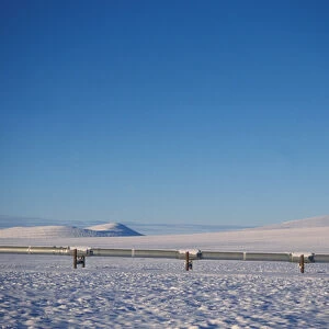 Alaskan pipeline on the snowy tundra of the North Slope of the Brooks Range, central