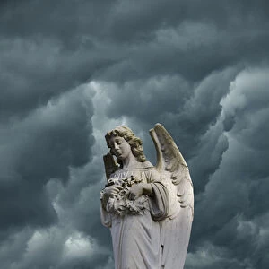 Artistic creation of angel and dark clouds