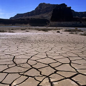 The dried-up lakebed of Lake Powell bakes in the sun below the bottom of Hite Marina