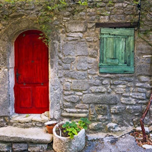 Europe, France, Saignon. Rustic stone house exterior