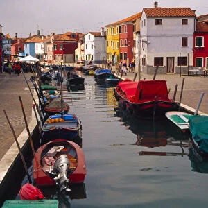 Europe, Italy, Venice, Burano. Colorful homes along canal on the island of Burano