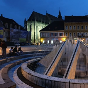 Europe, Romania, Brasov, The night view of fountain on the Sfatului square with the
