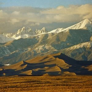 COLORADO: SAND DUNES. Sand dunes and the Crestone Peaks of the Rocky Mountains at the Great Sand Dunes National Park in Colorado. Photograph, c1970