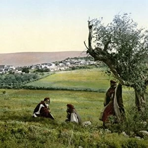 GALILEE: CANA, c1895. Men resting in a field before the village of Cana in Galilee