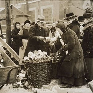 GERMANY: INFLATION, 1923. Berliners selling tin cans for scrap during severe inflation of 1923