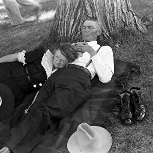 OREGON: COUPLE, 1941. A couple relaxing on a blanket under a shady tree after watching