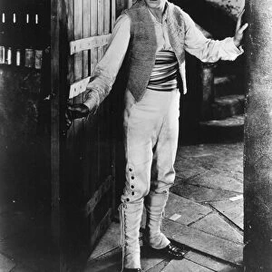 RUDOLPH VALENTINO (1895-1926). American (Italian-born) film actor. In a scene from the film Blood and Sand, 1922
