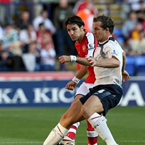 Fabregas vs. Davies: Intense Battle for Ball Possession - Arsenal vs. Bolton Wanderers, Premier League 2008-09