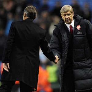 Managers Arsene Wenger (Arsenal) and Roberto Mancini (Man City) shake hands ast the end of the match. Manchester City 0: 3 Arsenal, Barclays Premier League, City Of Manchester Stadium, Manchester, 24 / 10 / 2010. Credit : Stuart MacFarlane / Arsenal
