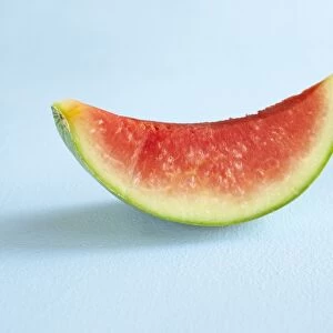 Citrullus lanatus, Watermelon, slice showing red flesh, side view