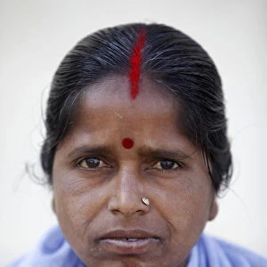 Indian woman wearing sindur and marriage mark in her hair