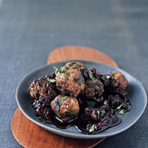 Kebab b il karaz, Turkish lamb meatballs with sour cherry sauce and parsley, on a plate
