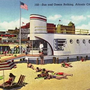 Sunbathing at Beach. ca. 1943, Atlantic City, New Jersey, USA, 102-Sun and Ocean Bathing, Atlantic City, N. J. Surf bathing, the finest in the world, on a gradually sloping, safe, golden-sanded beach, is enjoyed by Atlantic Citys millions from May to October. Several splendid indoor salt water pools provide year- round bathing