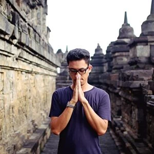 Asian man in blue tshirt at Borobudur temple