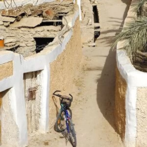 Modern bike parking in a lane in the Old town of Ghadames, UNESCO world heritage, Libya