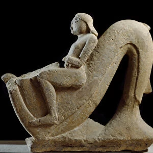 Etruscan art: stone statue depicting a young man riding a dolphin, 550 AD