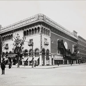 A huge theater with an elaborate facade, complete with Moorish arches and balconies