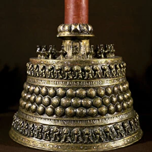 Islamic Art: bronze candlestick with silver inlay. Persian art of the 12th century