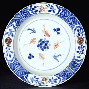 Plate decorated in underglaze blue with touches of copper red, late Ming dynasty, c