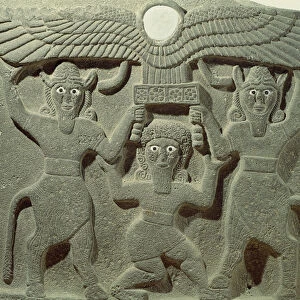 Relief depicting Gilgamesh between two bull-men supporting a winged sun disk