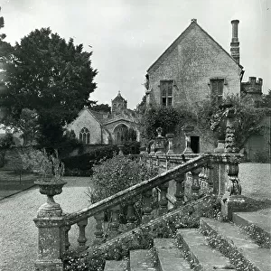 View of the church and the Priest's House from the terrace at Brympton d'Evercy, from 100 Favourite Houses (b/w photo)
