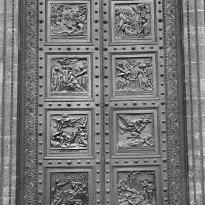 View of the door of La Madeleine comprising of eight relief panels depicting
