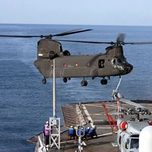 An Army CH-47 Chinook pulls in for a landing aboard USS Blue Ridge
