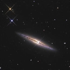 NGC 4013 is an edge-on unbarred spiral galaxy in the constellation Ursa Major