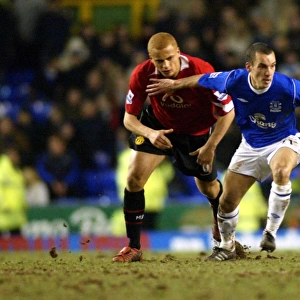 Leon Osman gets the better of Wes Brown