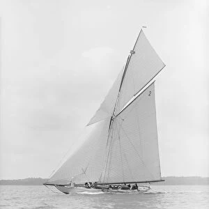 The 40-rater cutter Carina sailing close-hauled, 1913. Creator: Kirk & Sons of Cowes