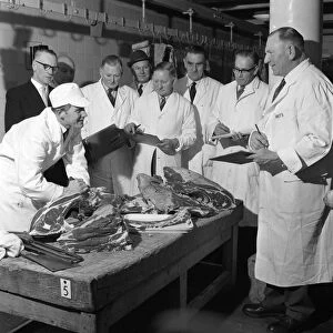 Apprentice butcher showing his work to competition judges, Barnsley, South Yorkshire, 1963