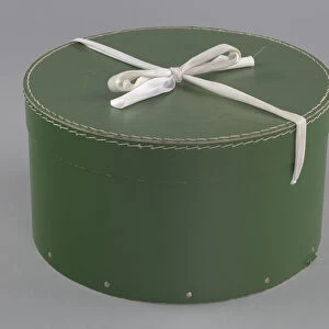 Green circular hatbox with lid from Maes Millinery Shop, 1941-1994. Creator: Unknown