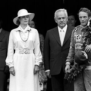 Formula One World Championship: HSH Princess Grace and HSH Prince Rainier with race winner Niki Lauda Ferrari, on the podium