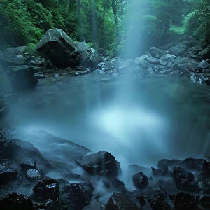 A cascading waterfall along a swift stream called Roaring Fork