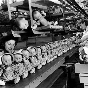 Some of these 1947 dolls for your children are coming off the moving belt