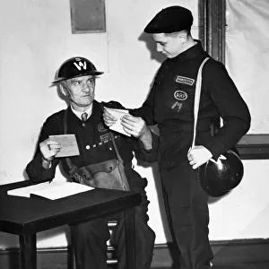 An Air Raid Precaution (ARP) warden and a messenger who wears the 1941 dark blue uniform