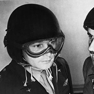 US Airmen model new protective helmets during Second World War. Circa 1944
