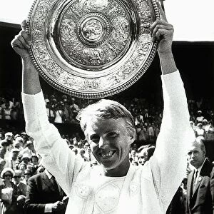 Ann Jones tennis player with Wimbledon womens trophy held above head after beating Billie