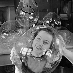 Barbara Hamilton, beauty queen of Egypt in 1945, seen through a bubble which she holds in