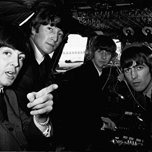 Beatles 1960s pop band in the cockpit of an aircraft before flying to Liverpool