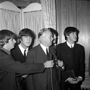 The Beatles and Harold Wilson MP (centre), Labour Party Leader who presented them with