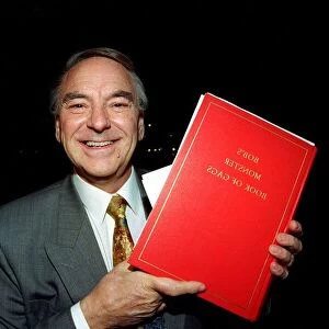 Bob Monkhouse Comedian / TV Presenter holding the book of gags that was stolen from his