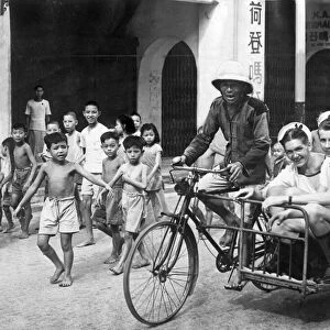 British sailors of the Royal Navy on shore leave in Singapore are transported by an