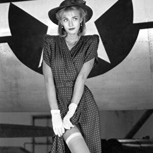Fashion - 1940 s: Print dress teamed with hat, gloves and stockings