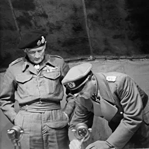 Field Marshal Bernard Montgomery watches General Kienzl the Chief of Staff to German