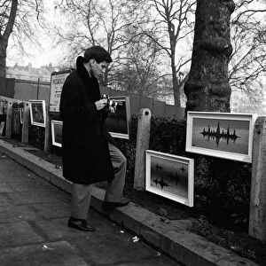 Frank Sinatra Junior in London January 1964 looking at painting displayed on fence