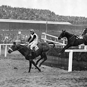 The Grand National 1947 Over the gaping water jump at Aintree