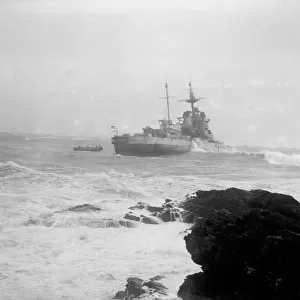 H. M.s Warspite on way to ship breakers yard is driven ashore by a gale at Mounts Bay