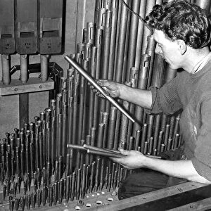 Mr. Gordon Pratt replacing some organ pipes in May 1957. 08 / 05 / 57
